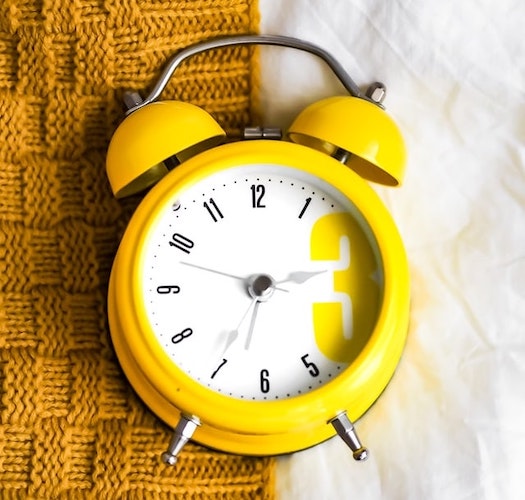 Yellow and white alarm clock